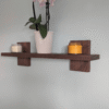 Modern Solid Black Walnut Scandi Floating Shelf - angled image with candles and orchid