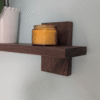 Modern Solid Black Walnut Scandi Floating Shelf - closeup angled image with candle