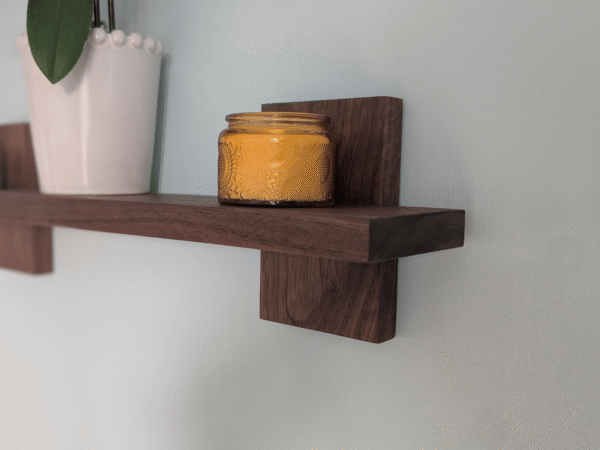 Modern Solid Black Walnut Scandi Floating Shelf - closeup angled image with candle